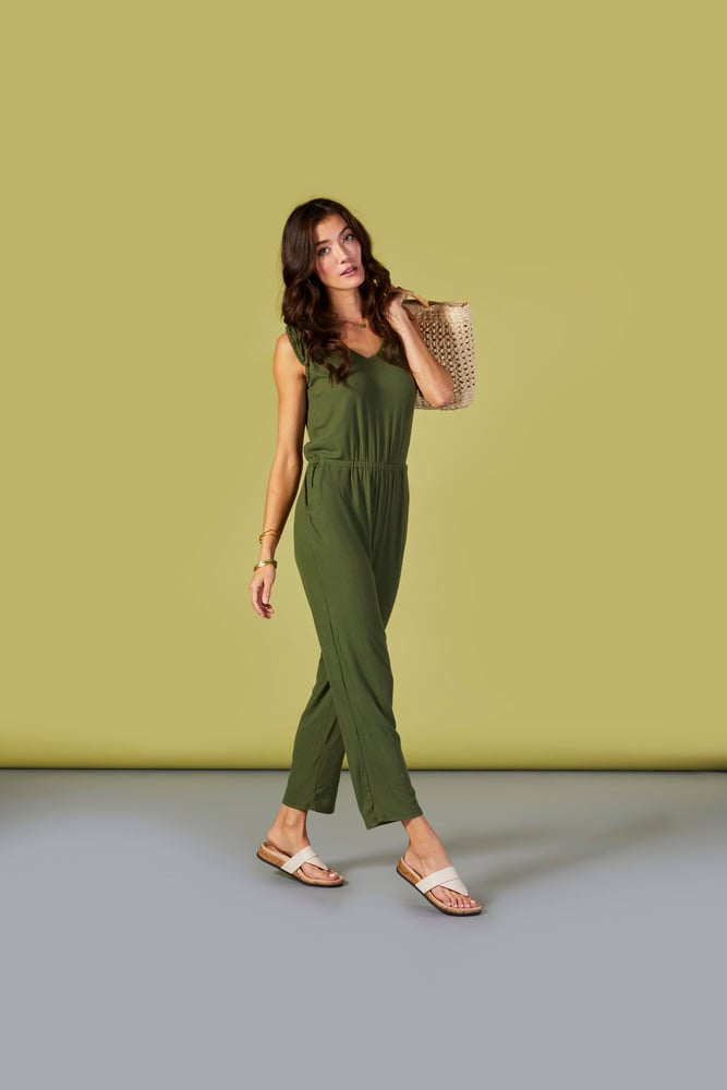 Pretty girl in summer jumpsuit and sandals
