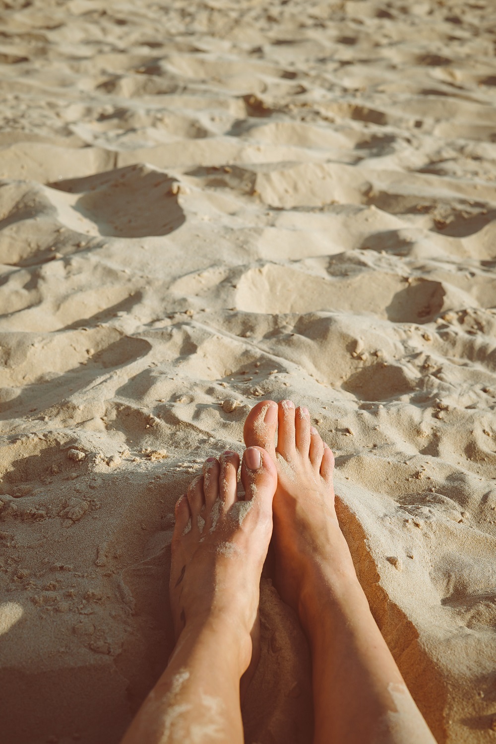 Bare feet in the sand
