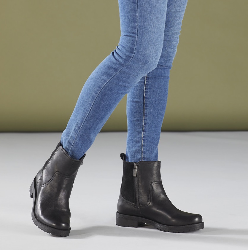 woman wearing black booties