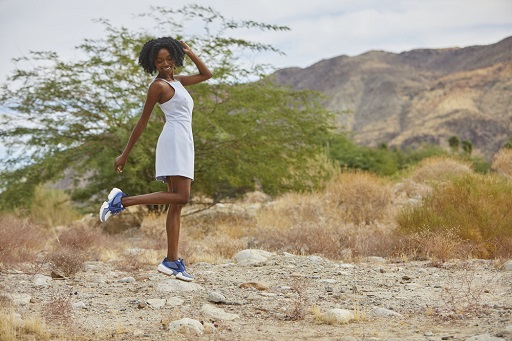 Woman wearing sporty dress and cmfortable tennis shoes