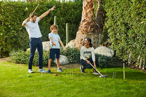 Family having fun in the backyard, wearing comfortable shoes