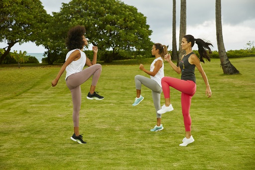 The woman working out on a grass