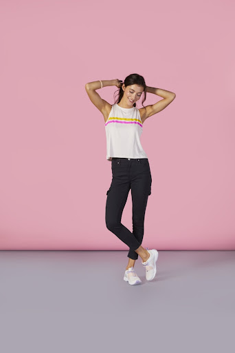 Woman in sporty outfit with sneakers