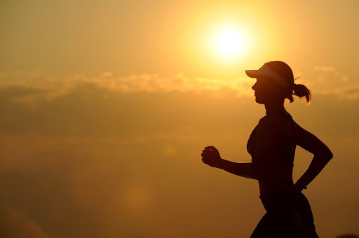 Woman jogging in sunset