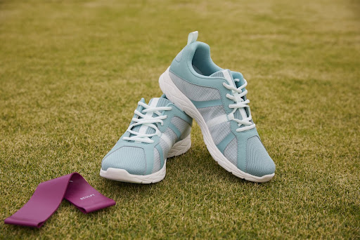 pair of sneakers on the grass field