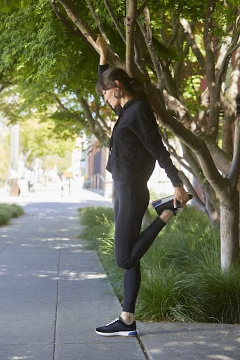 Woman stretching after a walk